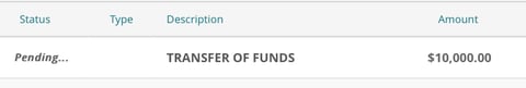 Table row showing pending transfer of funds transaction for $10,000.00