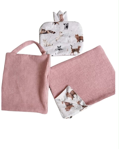 Set of three baby bibs with cat print and pink quilted fabric, displayed flat on white background