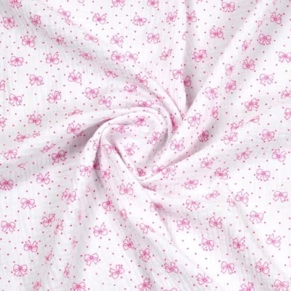 Pink and white floral fabric with gathered center detail and scattered flower print pattern