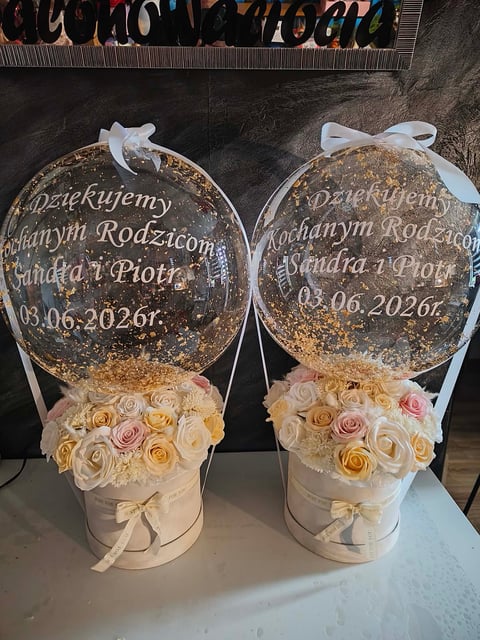 Two floral arrangements with cream-colored roses and gold glitter balloons with Polish text celebrating a wedding, dated 03.06.2026