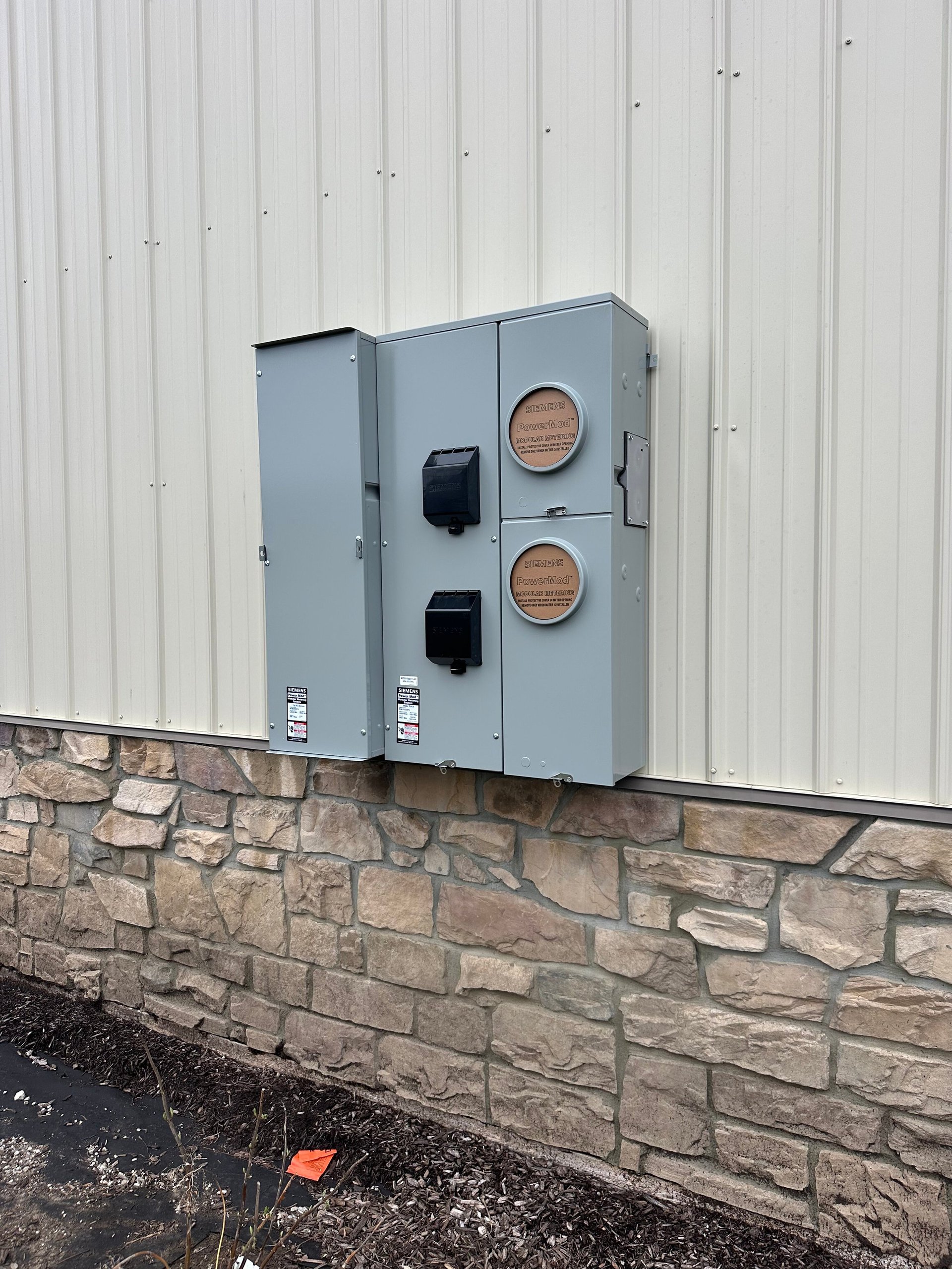 Modern electrical service panel mounted on a wall — Dylco Electric panel upgrade in Westfield, IN