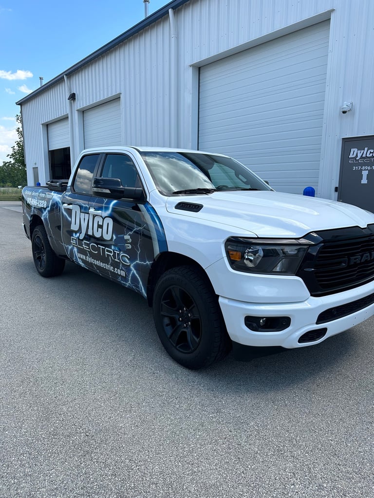 Dylco Electric wrapped service truck parked outside the Westfield shop — family-built and locally owned since 2004