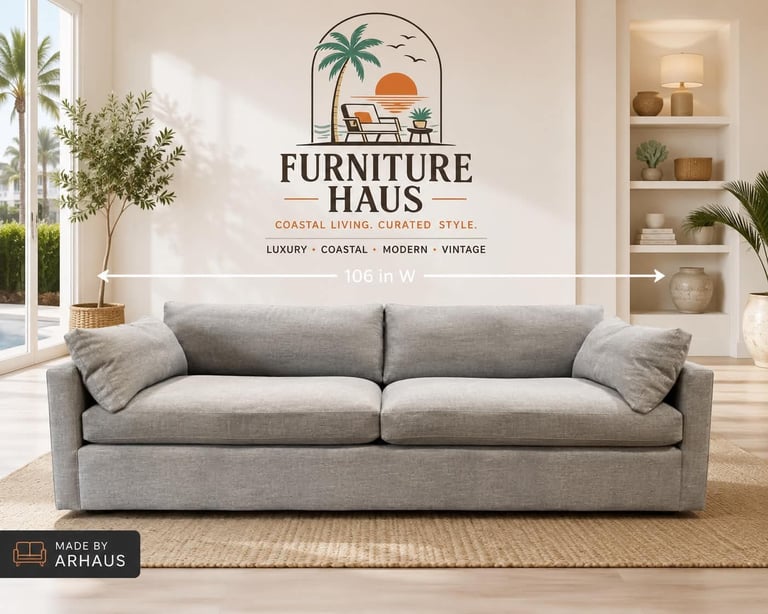 Gray upholstered sofa in modern living room with Furniture Haus branding and coastal decor aesthetic