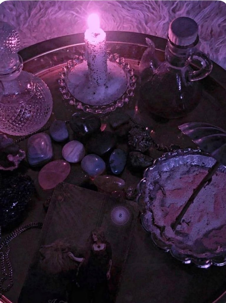 Mystical altar display with glowing purple candle, crystals, potion bottles, and occult items on dark surface