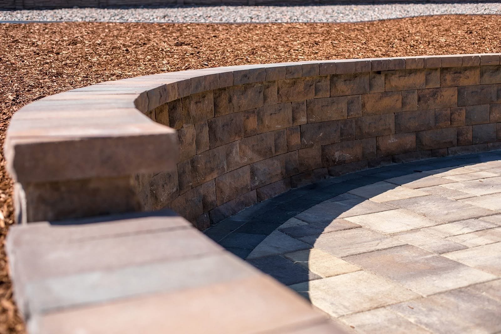 Stone pathway through a garden with colorful flowering plants