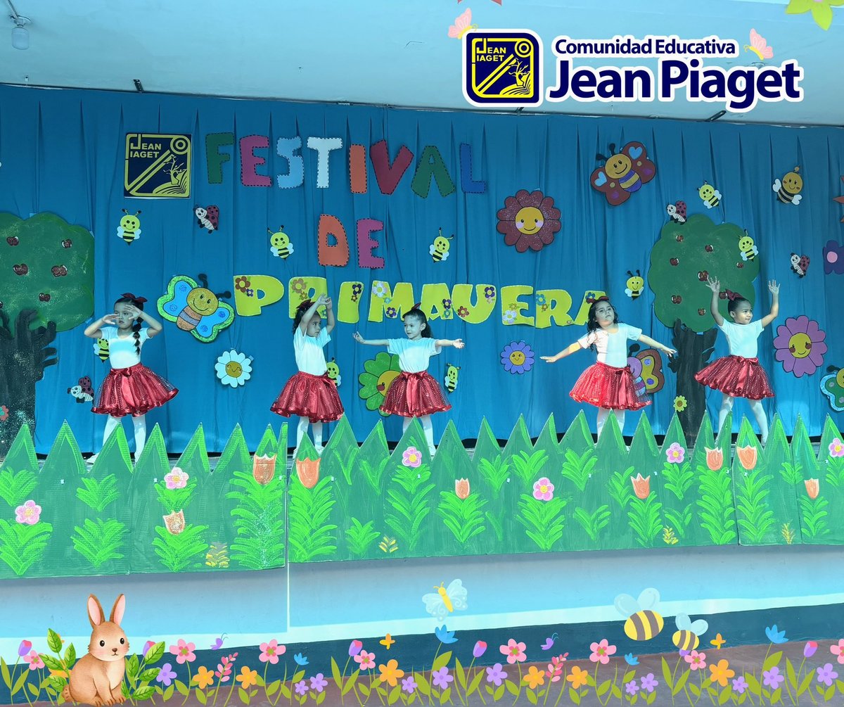 School mural with colorful spring theme featuring paper cutout figures, flowers, and Festival de Primavera sign