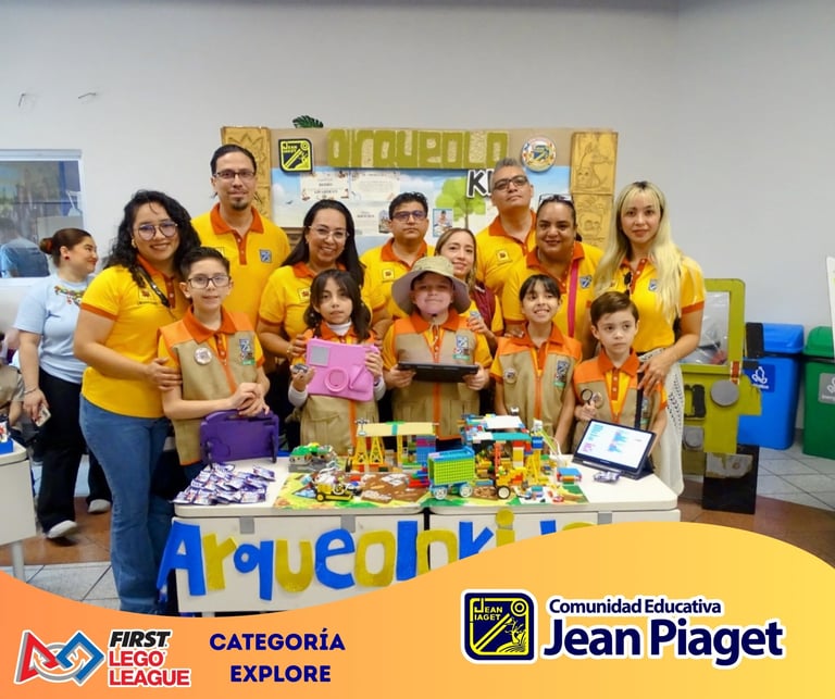 FIRST LEGO League team in yellow shirts posing with robots and displays at Jean Piaget educational event