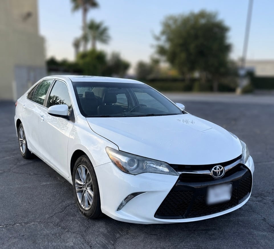 White Toyota Camry — a free rental car for collision repair customers at Best Collision Center
