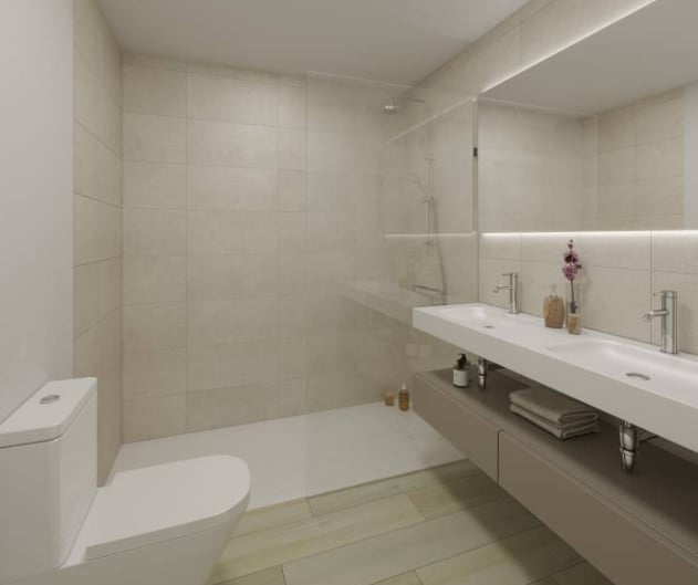 Modern minimalist bathroom with beige tiles, white toilet, floating vanity with dual sinks, and glass shower enclosure