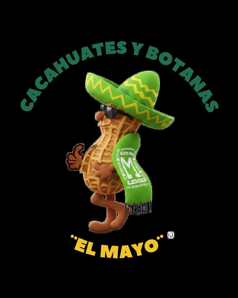 El Mayo peanut mascot wearing a green sombrero and poncho with yellow zigzag pattern, holding a thumbs up gesture