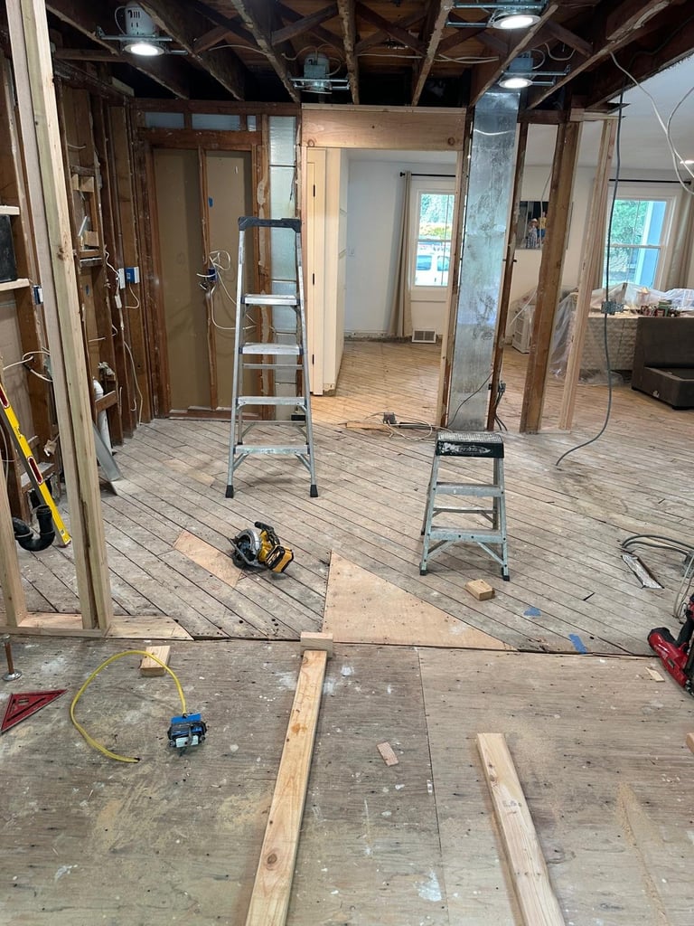 Interior home renovation with exposed framing and tools