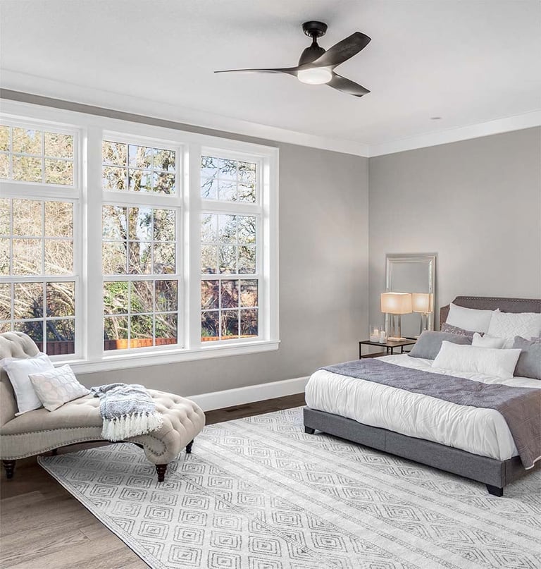 Modern bedroom with large impact windows, quiet and comfortable