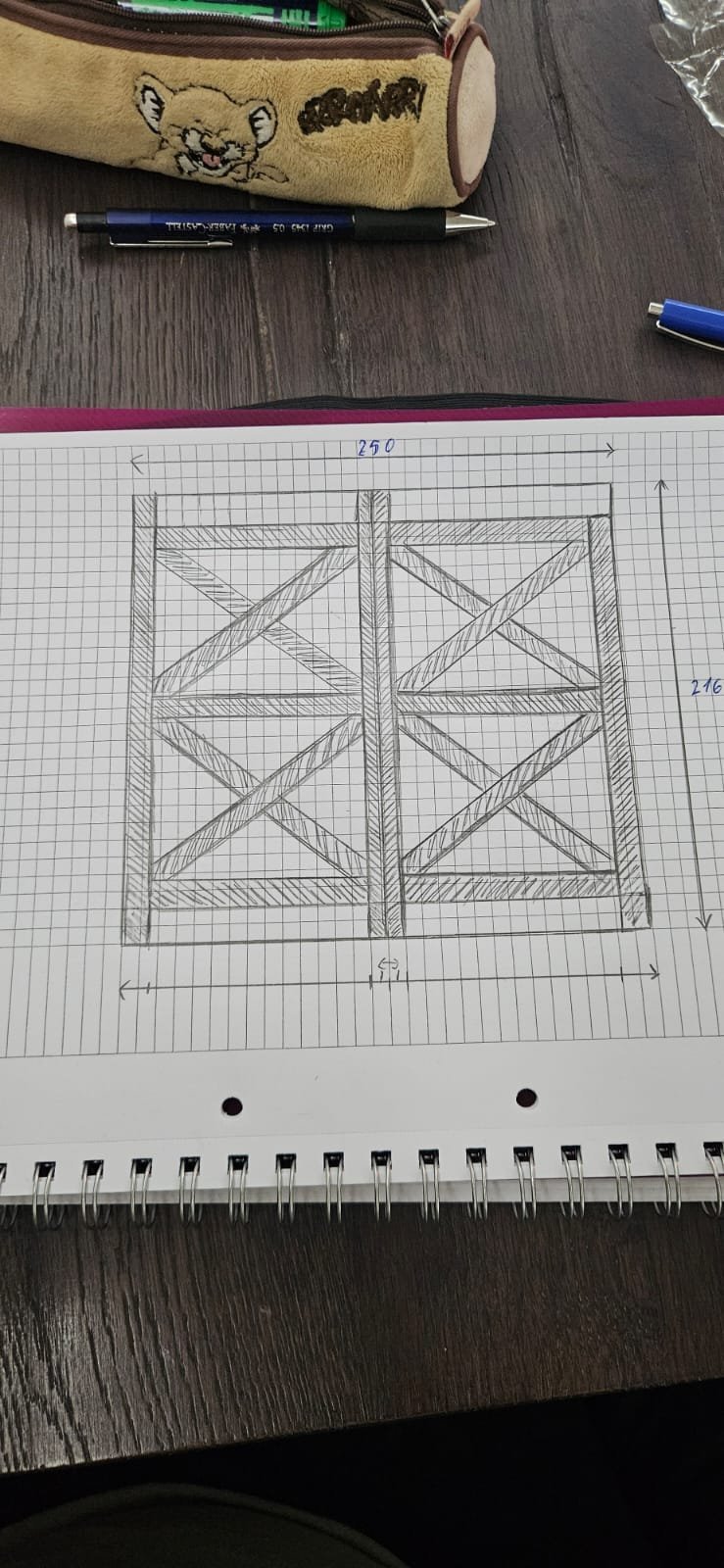 Technical sketch of a double-door gate design with X-pattern panels on graph paper, showing measurements and dimensions