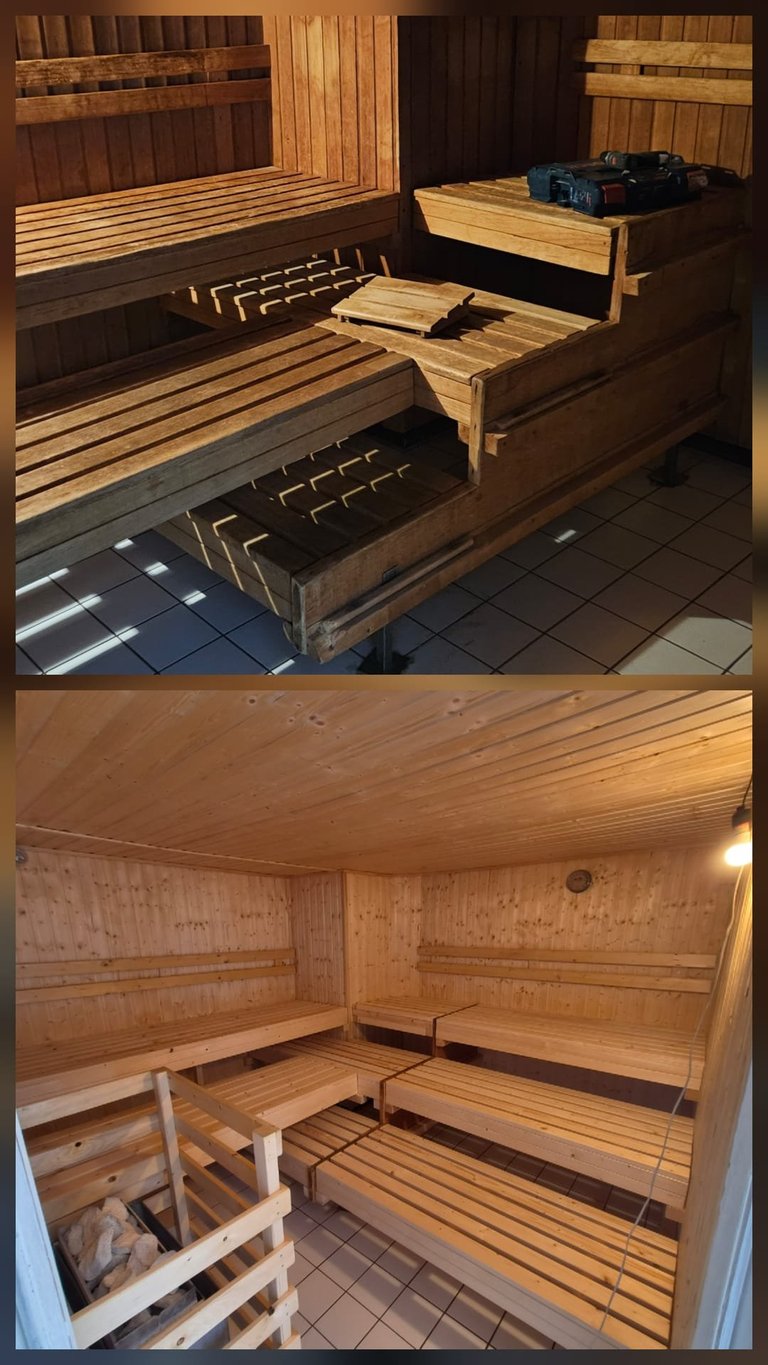 Interior of a wooden sauna showing multiple wooden benches at different levels with heating elements visible on the floor.