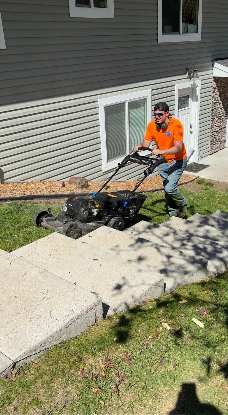 MN Diamond Cut team member providing professional lawn care service