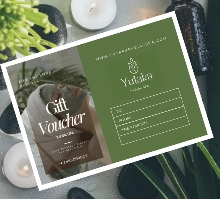 Yutaka Facial Spa gift voucher displayed on a marble surface with candles and green foliage surrounding it