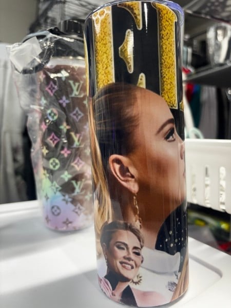 Custom printed tumbler with a portrait photo and black and yellow pattern