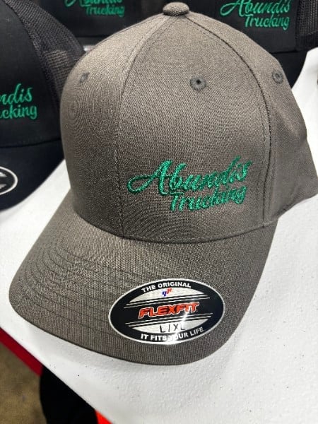 Gray cap with green embroidered trucking logo