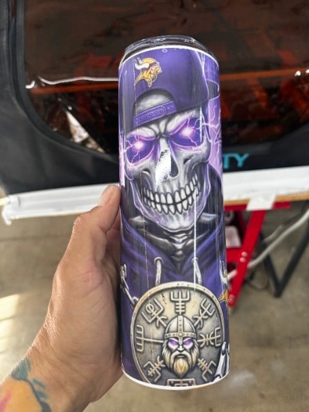 Tall drink can wrapped with a custom purple design