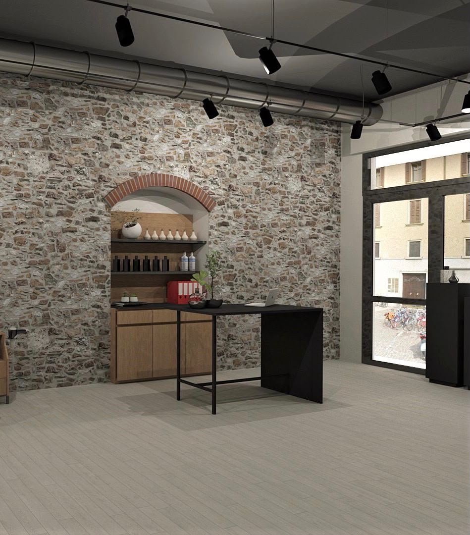 Modern interior space with textured stone wall, arched niche shelving, wooden counter, black desk, track lighting, and glass storefront doors