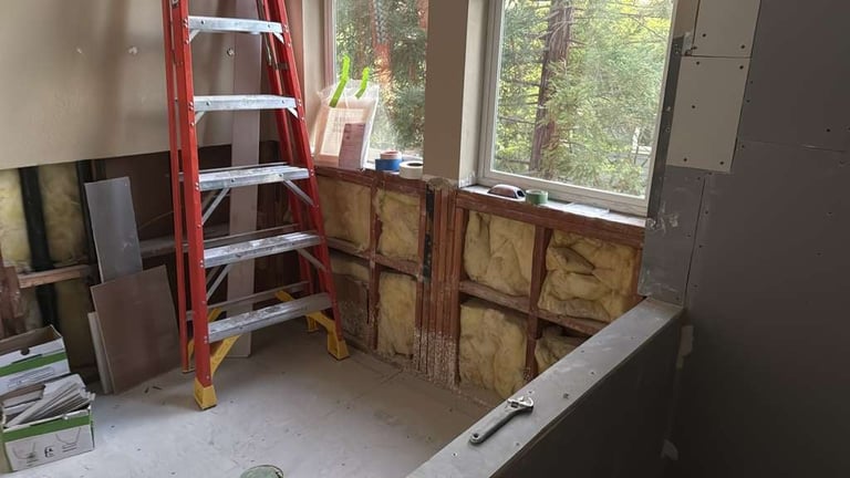 Bathroom under renovation with exposed walls