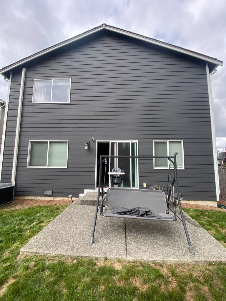 House with concrete patio before deck addition