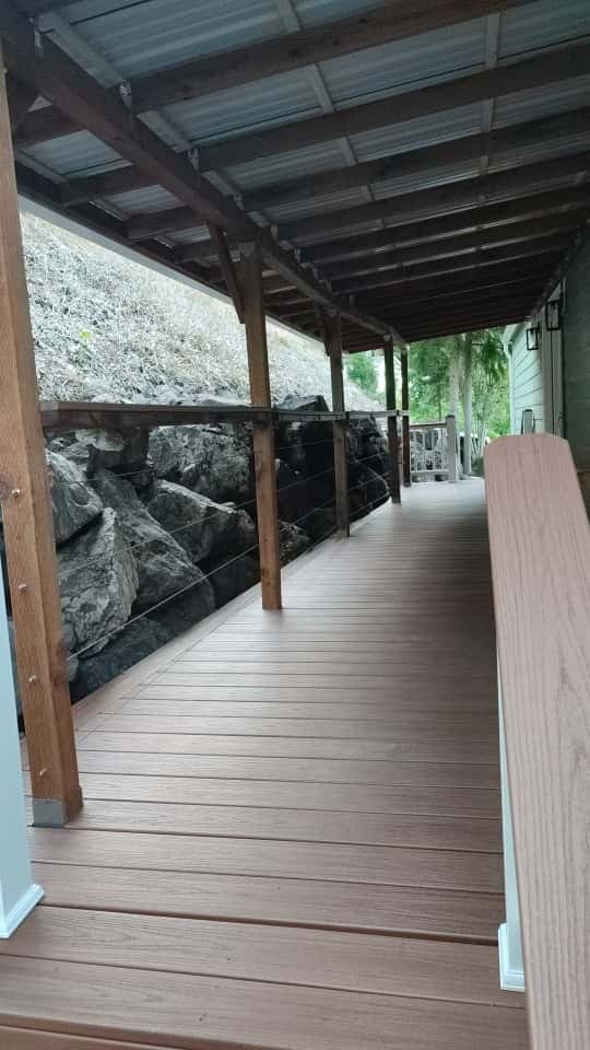 Covered deck with new metal roof and cable railing