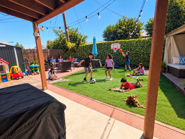 Children playing in a backyard with grass, playing equipment, and a basketball hoop under a wooden pergola
