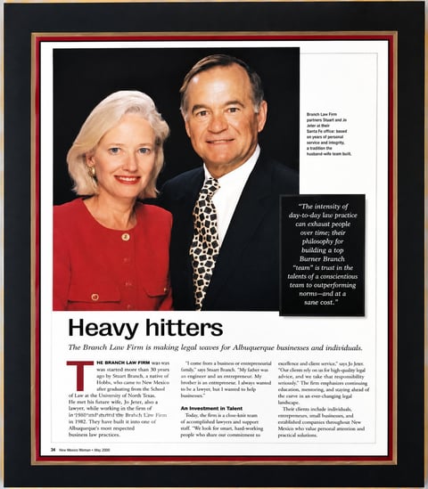 Magazine article titled Heavy hitters featuring a professional portrait photo of a man and woman in business attire with accompanying text content