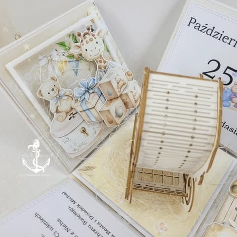 Flat lay of decorative stationery including a patterned notepad, wooden beach chair ornament, calendar page showing October 25, and small botanical embellishments on white background