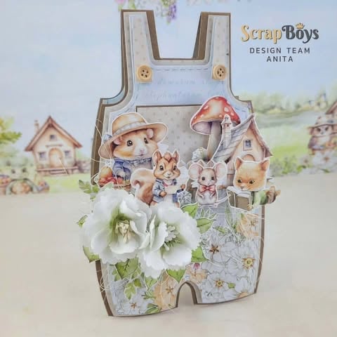 Scrapbooking card featuring woodland animals in overalls with white flowers and cottage background by ScrapBoys Design Team
