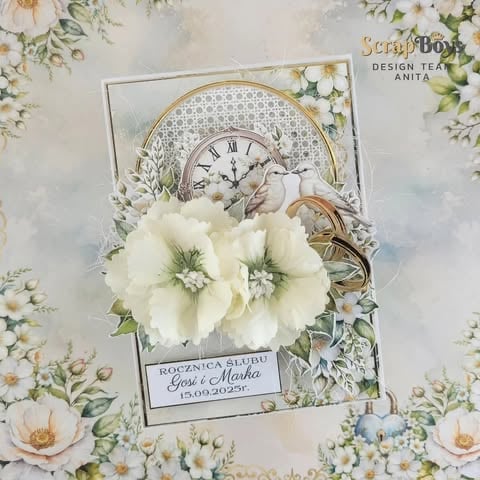Vintage-style birthday card with white 3D flowers, ornate clock face, butterfly, and handwritten 'Najpiekniejsze życzenia' text with floral background