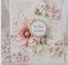 Floral greeting card with pink and white flowers arranged around a circular center text frame