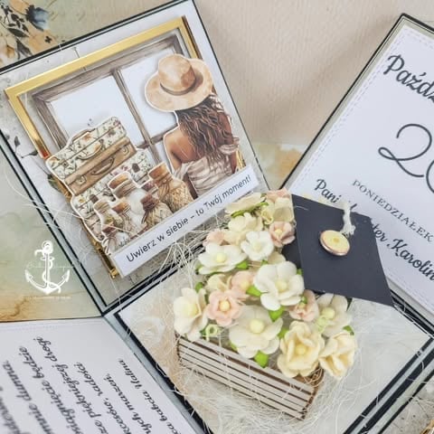 Flat lay of beach-themed décor including framed photos, cream and pink flowers in a woven basket, and open books on a light surface.
