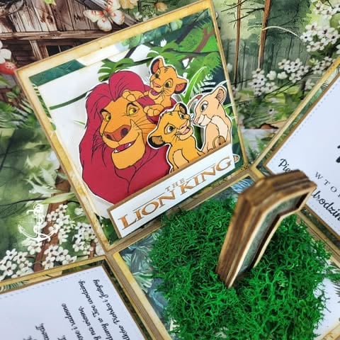 Framed The Lion King artwork with animated characters displayed among green moss and decorative elements
