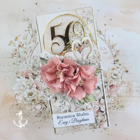 Elegant 50th wedding anniversary greeting card with pink flowers, dried botanicals, gold numerals, and decorative ribbon on white background