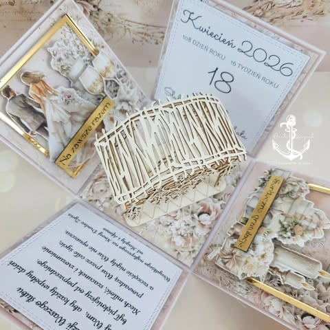 Elegant wedding invitation set from 2026 featuring white comb, gold accents, and floral details arranged on beige background.