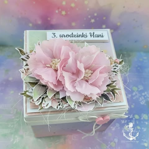 Gift box decorated with pink carnation flowers and greenery on pastel watercolor background