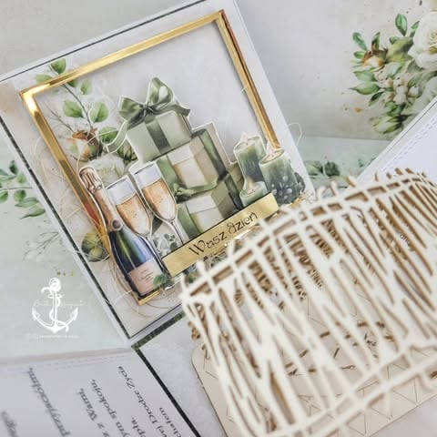 Flat lay of skincare and beauty products displayed with framed artwork, botanical stems, and woven table runner on light surface