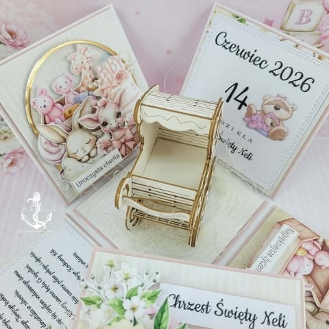 Baby shower gift set with pink floral plates, wooden pram, calendar, and personalized cards in soft pastel pink and cream tones