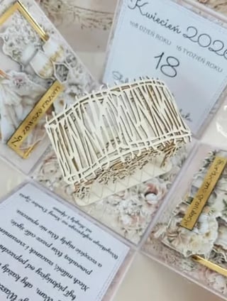 White woven basket bracelet displayed with product labels and packaging cards on a light floral background