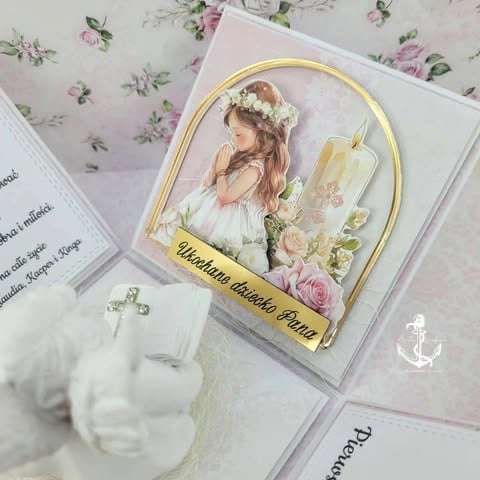 Religious first communion keepsake with illustrated girl in white dress and veil, surrounded by pink roses and gold accents.