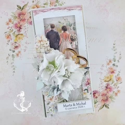 Wedding scrapbook layout with bride and groom photo, white flowers, gold rings, and decorative floral elements