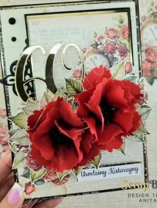 Handmade greeting card with red carnation flowers, vintage floral design, and decorative ribbon bow