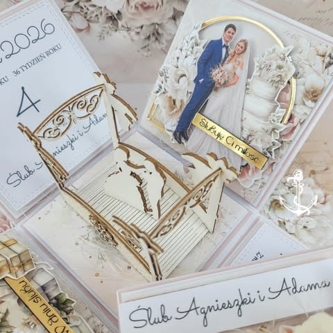Handmade wedding scrapbook pages with gold decorative elements, wedding couple photo, and personalized journaling on cream and white cardstock