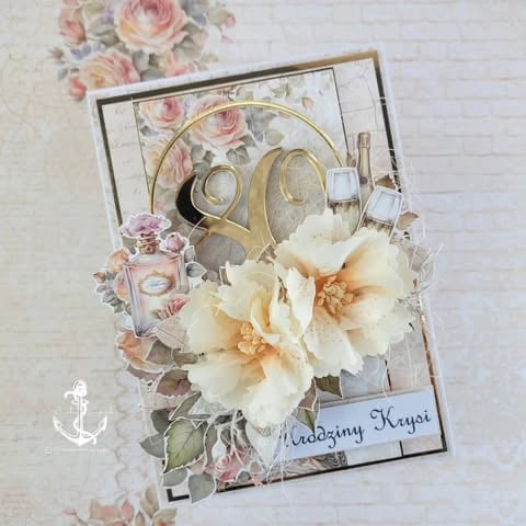 Vintage-style greeting card with floral decorations, cream and pink 3D flowers, gold circular frames, perfume bottle, and 'Urodziny Krysi' text on decorative paper