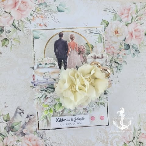 Scrapbook page with wedding photo of couple, cream and pink florals, decorative elements including anchor and floral frame around names Alidena and Jakub