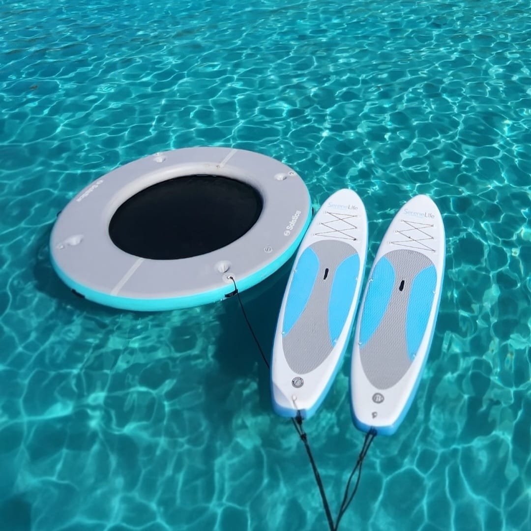 Good Ol' Days — floating tube and paddleboards in crystal clear turquoise water