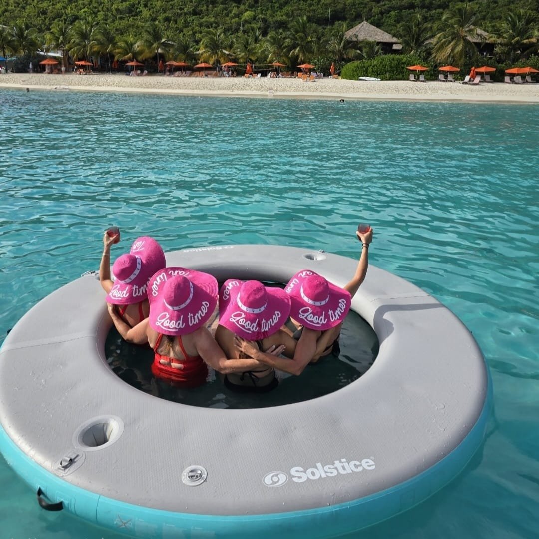 Good Ol' Days — people on inflatable float in turquoise ocean near tropical beach