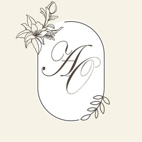 Elegant monogram letter H with decorative lily flower and botanical leaf elements in line drawing style